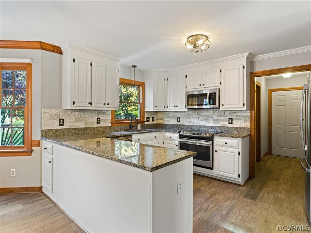13630 Spring Run Road Midlothian, VA 23112 - Photo 13 of 30 a kitchen with granite countertop a sink cabinets stainless steel appliances and a window