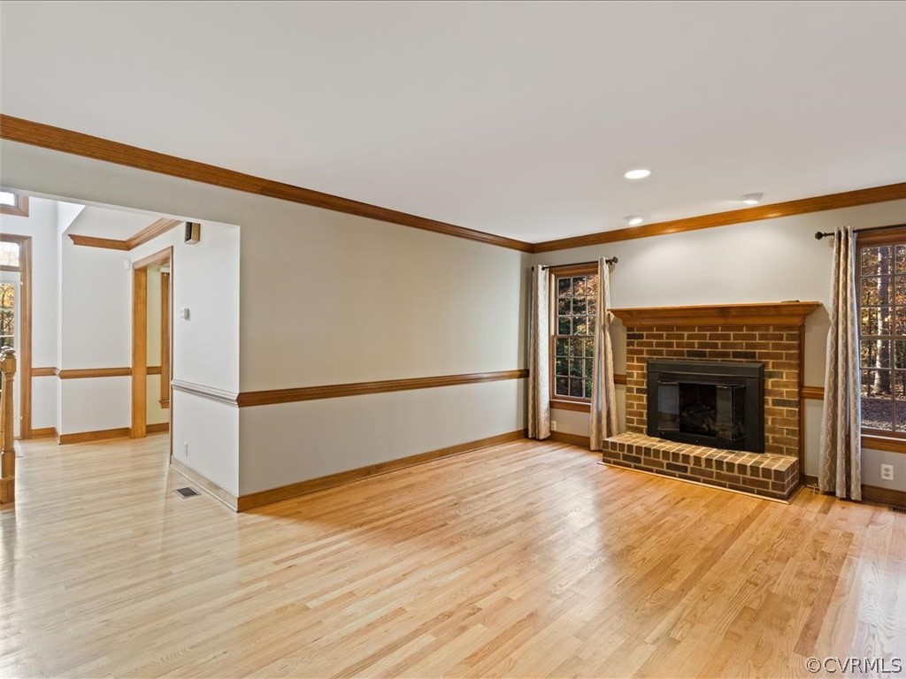 13630 Spring Run Road Midlothian, VA 23112 - Photo 14 of 30 a view of an empty room with wooden floor fireplace and a window