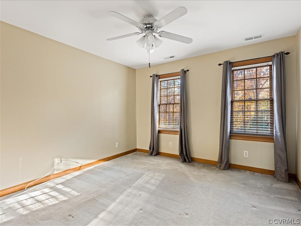 13630 Spring Run Road Midlothian, VA 23112 - Photo 15 of 30 an empty room with windows and fan