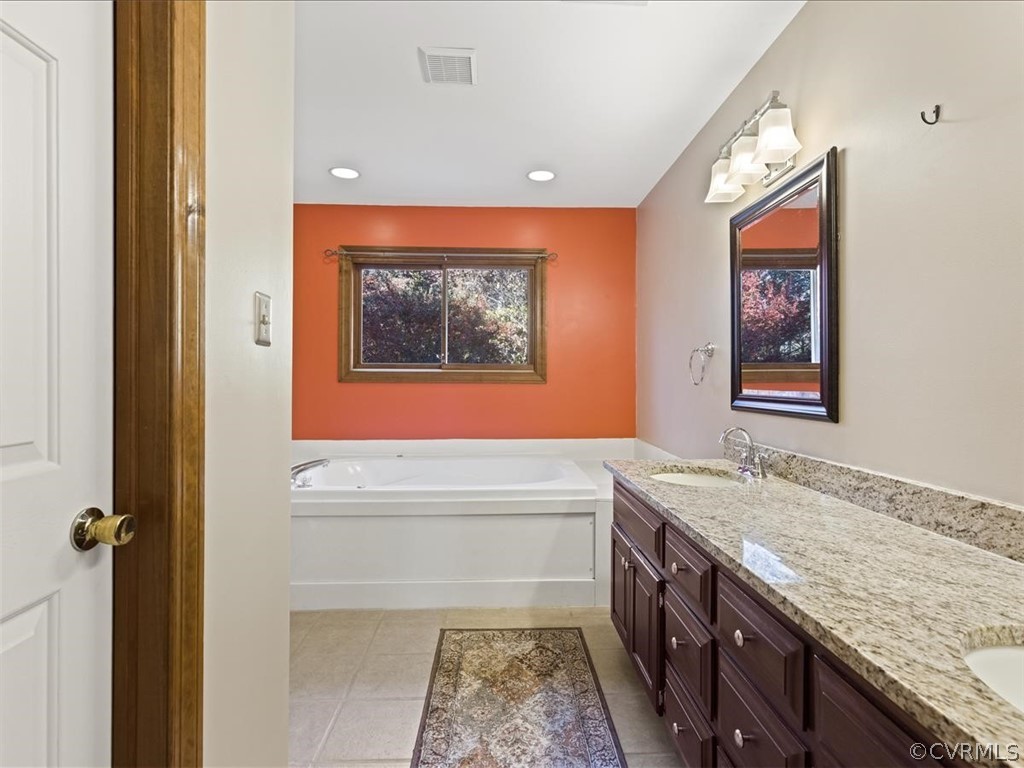 13630 Spring Run Road Midlothian, VA 23112 - Photo 18 of 30 a bathroom with a granite countertop tub sink and mirror