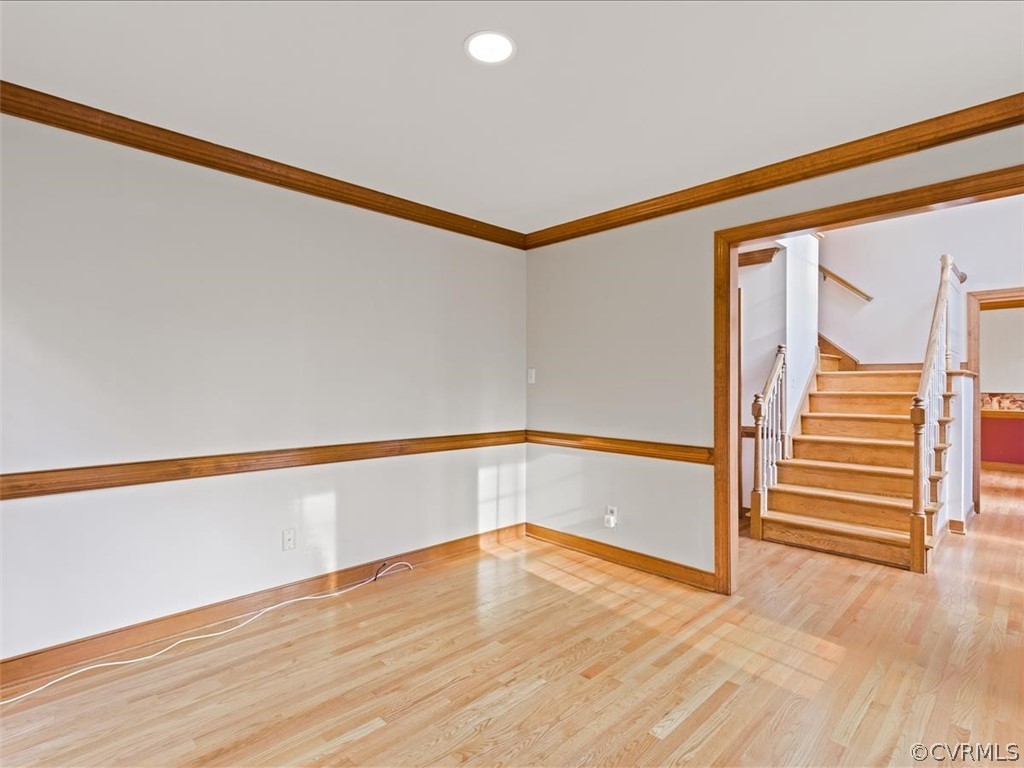 13630 Spring Run Road Midlothian, VA 23112 - Photo 26 of 30 a view of an empty room with wooden floor and stairs