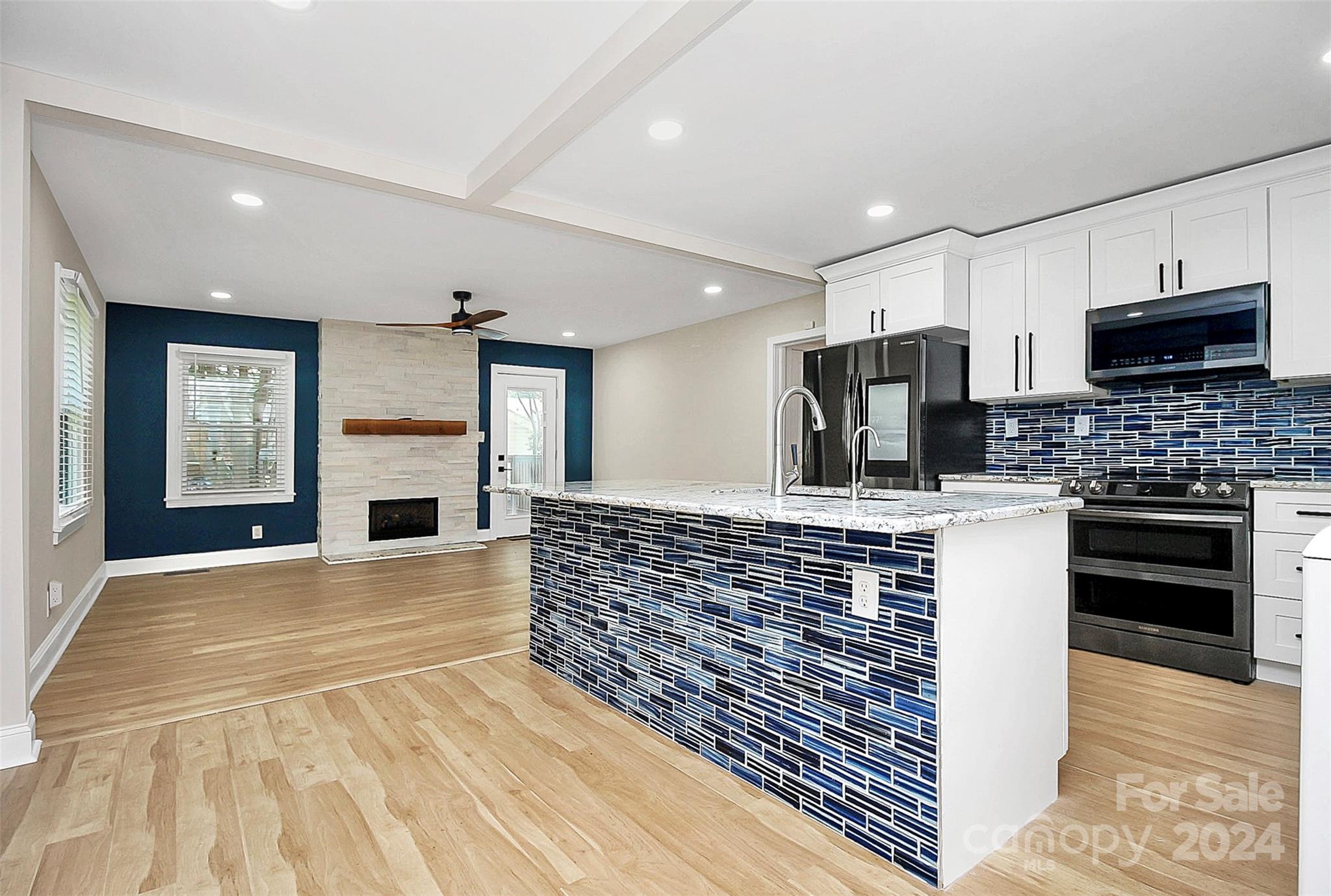 2742 Mayflower Road Charlotte, NC 28208 - Photo 11 of 37 a view of kitchen with stainless steel appliances kitchen island granite countertop a stove and a sink