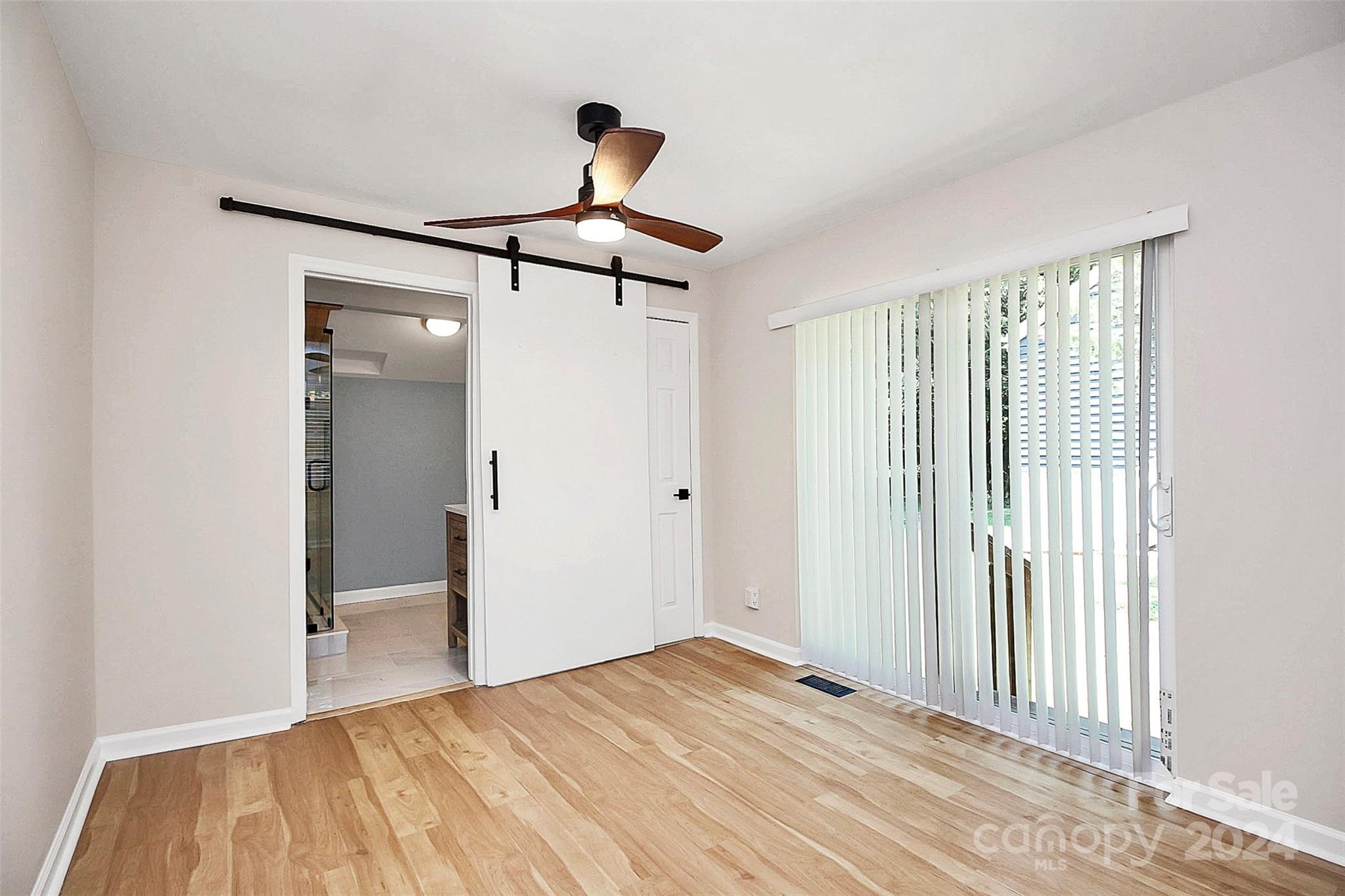 2742 Mayflower Road Charlotte, NC 28208 - Photo 17 of 37 a bedroom with a bed and a chandelier
