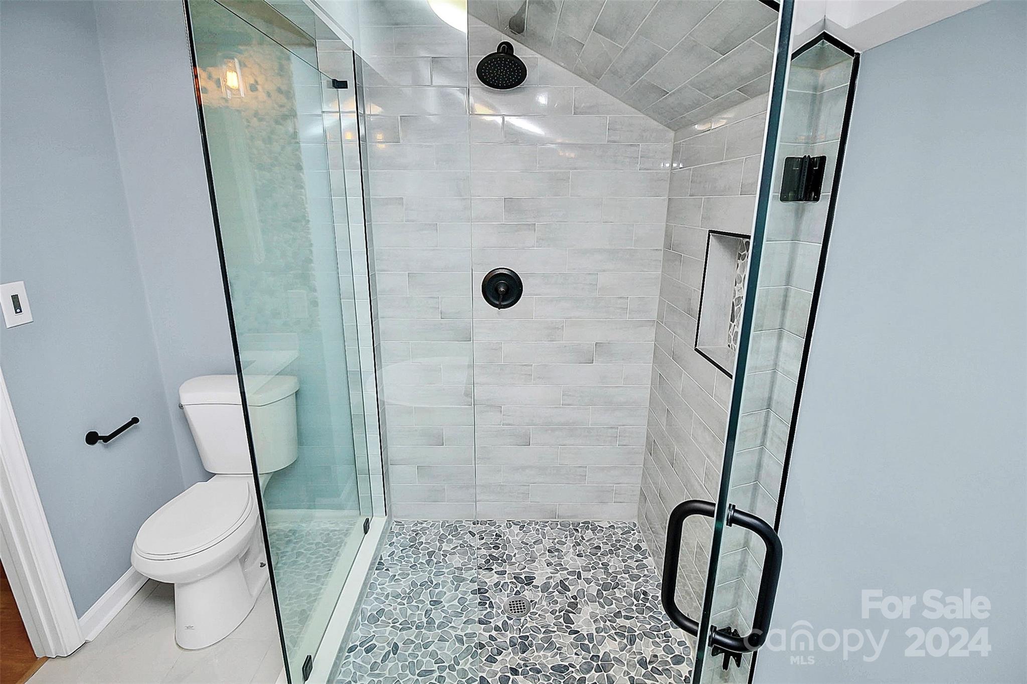 2742 Mayflower Road Charlotte, NC 28208 - Photo 20 of 37 a bathroom with a shower and a mirror