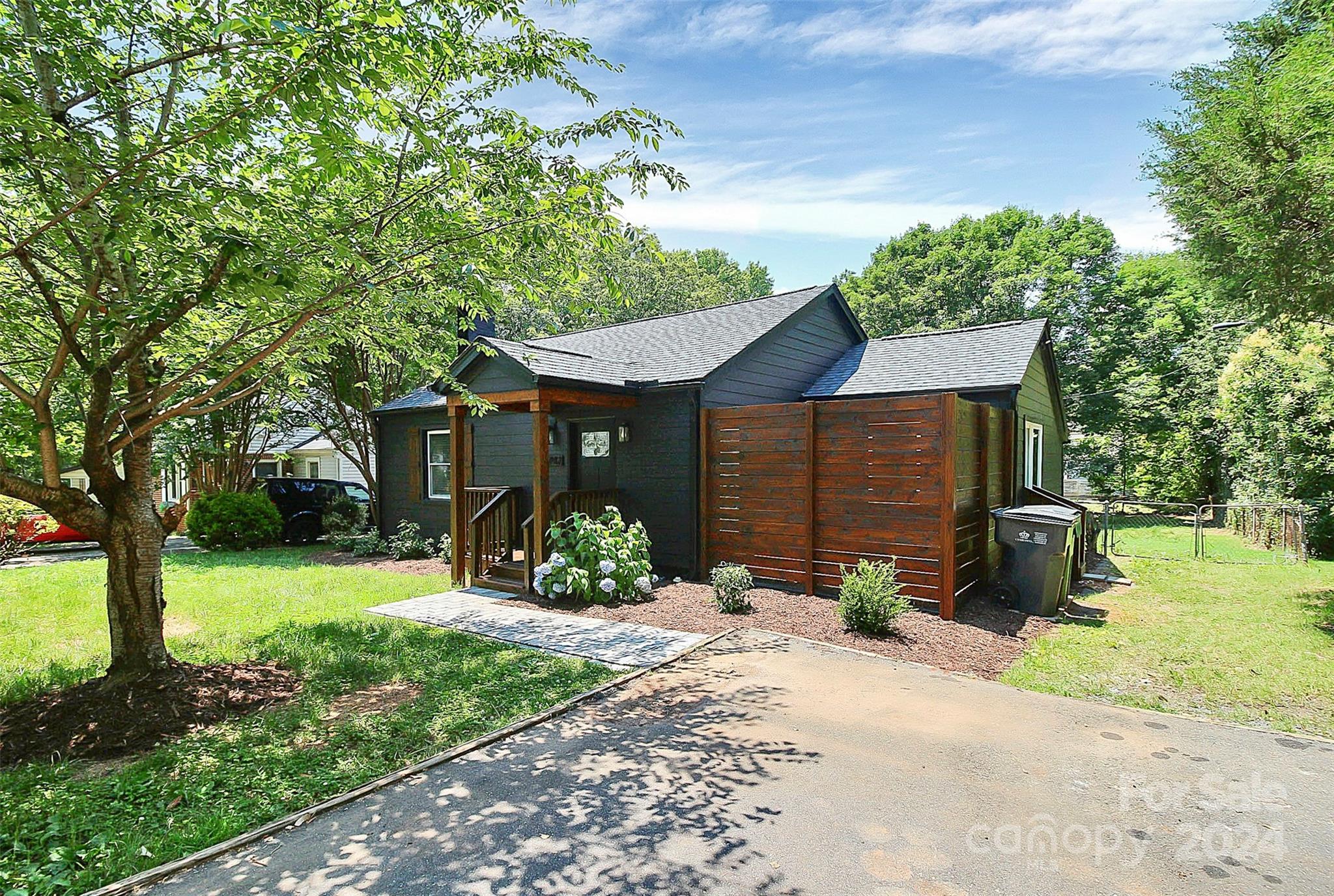 2742 Mayflower Road Charlotte, NC 28208 - Photo 2 of 37 a front view of a house with a yard and garage