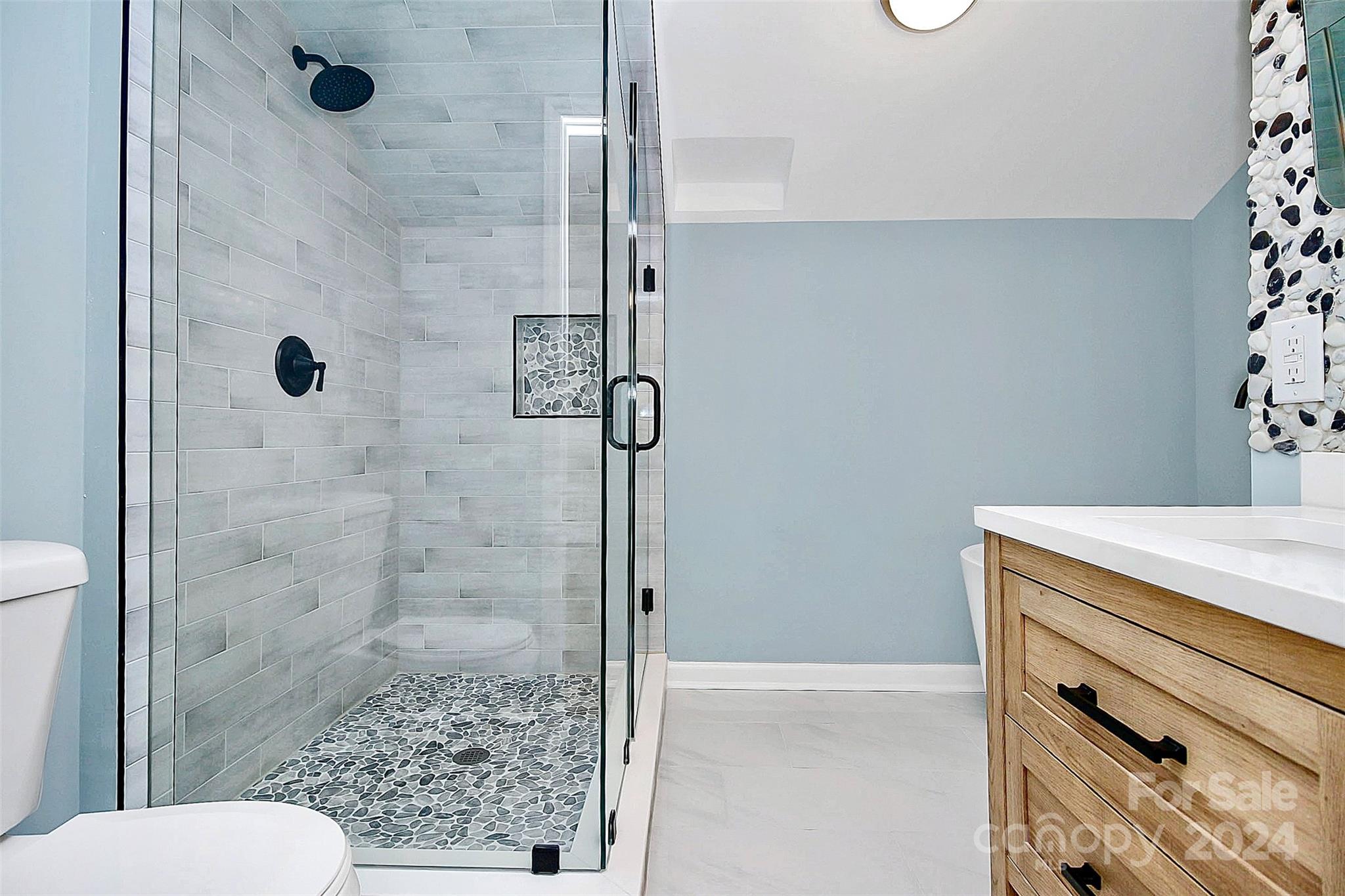2742 Mayflower Road Charlotte, NC 28208 - Photo 22 of 37 a bathroom with a shower and toilet