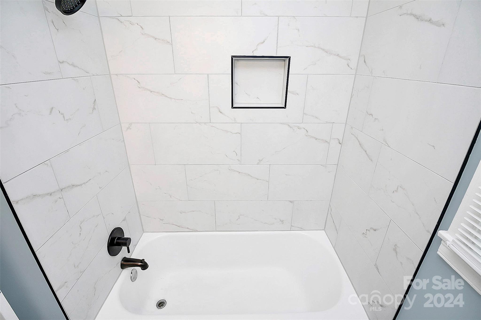 2742 Mayflower Road Charlotte, NC 28208 - Photo 26 of 37 a bathroom with a bathtub