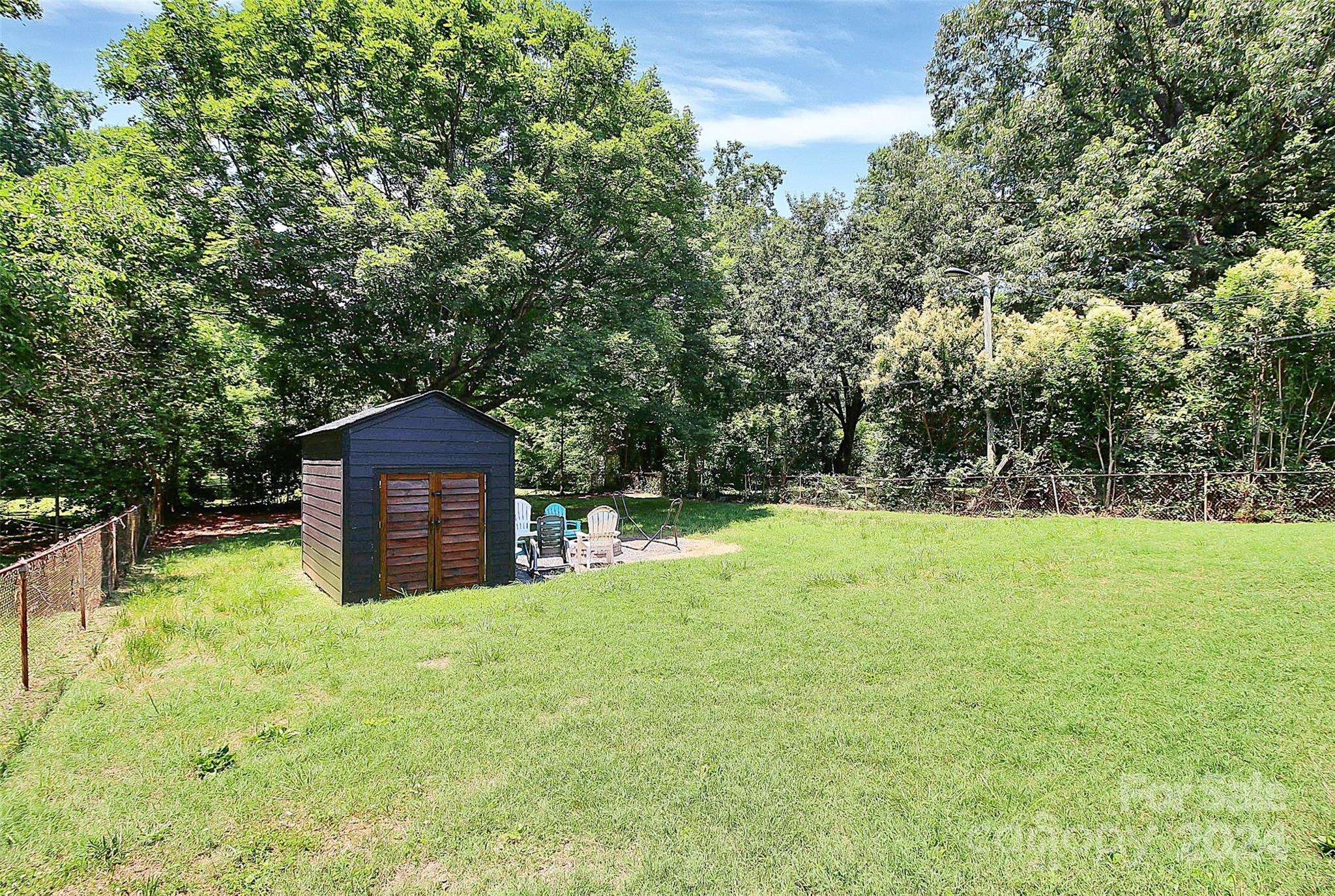2742 Mayflower Road Charlotte, NC 28208 - Photo 35 of 37 a house with trees in the background
