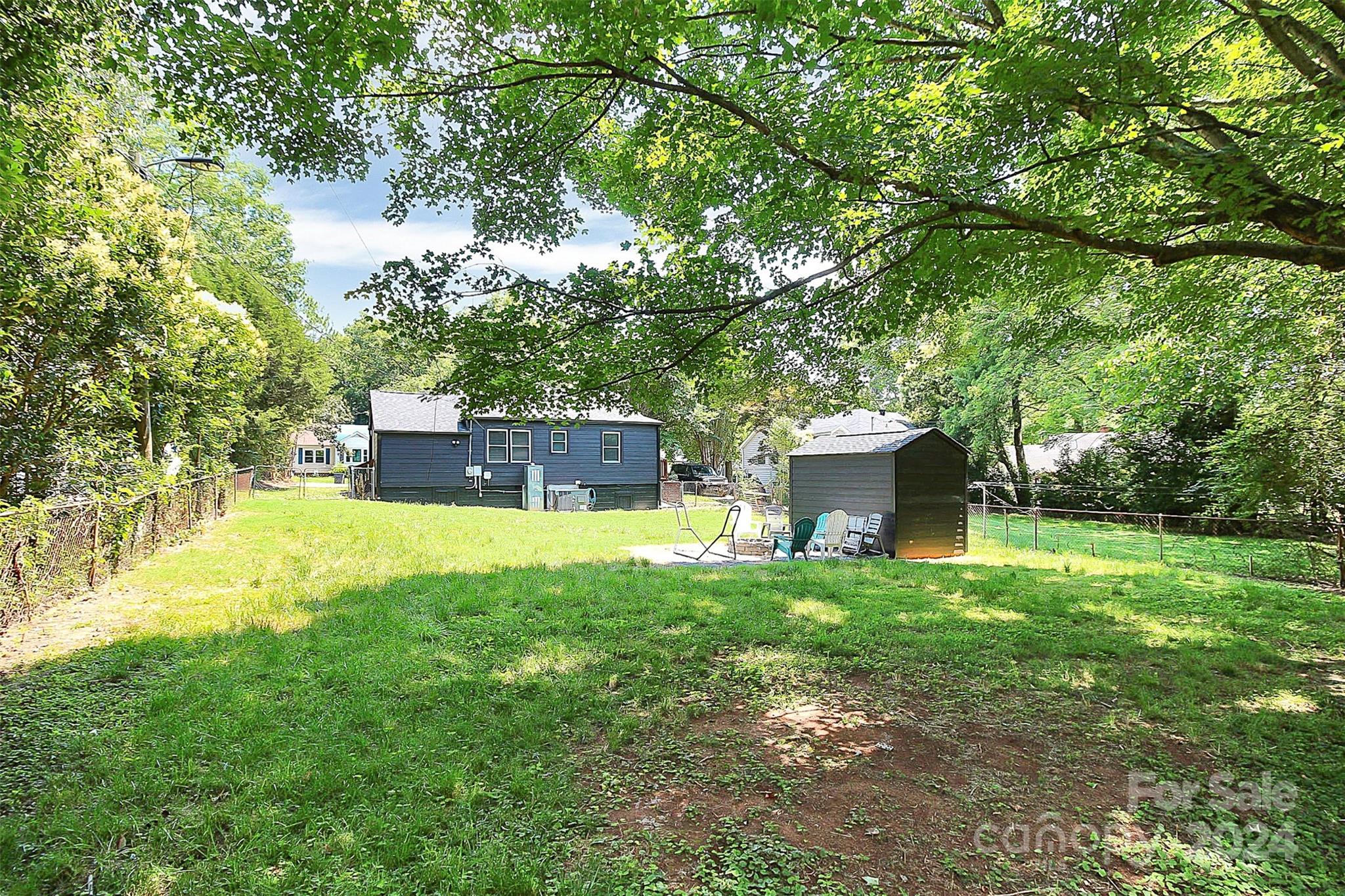 2742 Mayflower Road Charlotte, NC 28208 - Photo 36 of 37 a backyard of a house with table and chairs