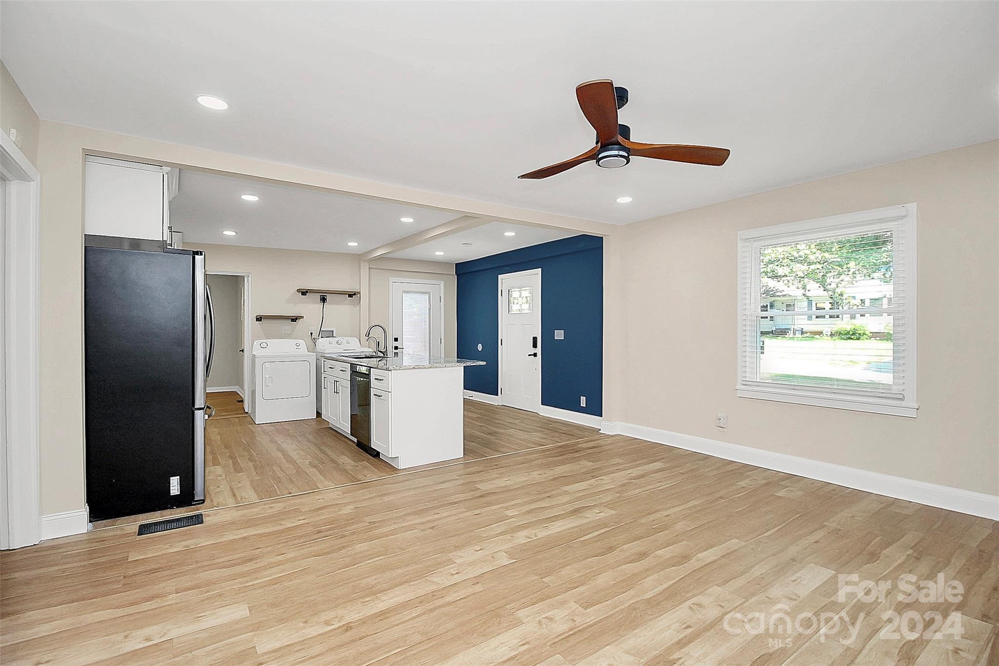 2742 Mayflower Road Charlotte, NC 28208 - Photo 8 of 37 a view of a kitchen with a refrigerator a microwave and a sink