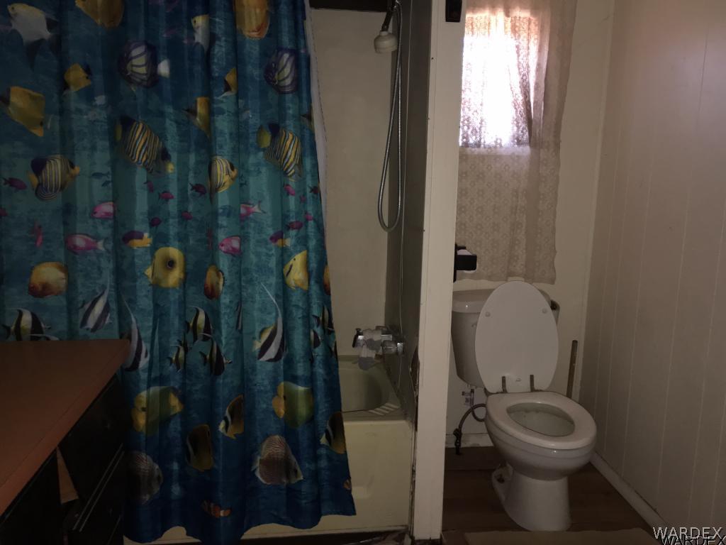 3293 Heber Road Golden Valley, AZ 86413 - Photo 16 of 22 a bathroom with a toilet and a sink