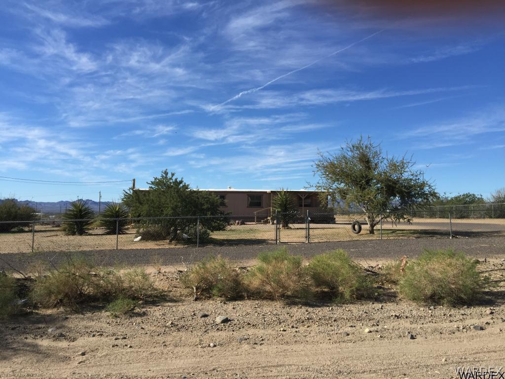 3293 Heber Road Golden Valley, AZ 86413 - Photo 5 of 22 a view of a lake and a yard