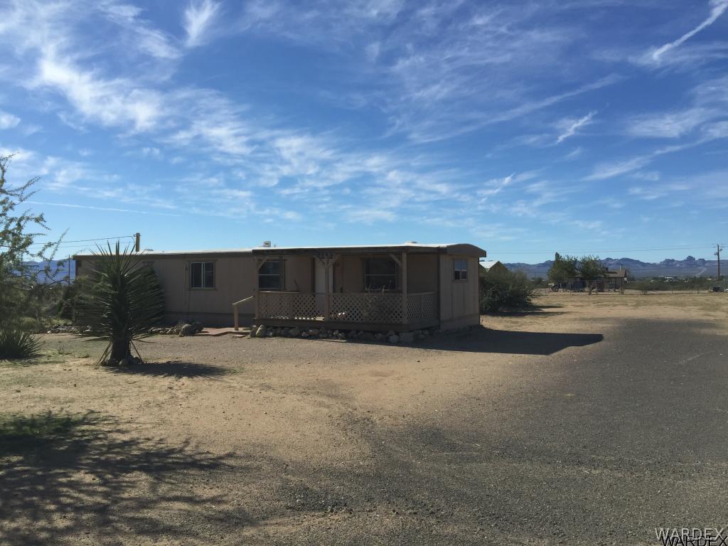 3293 Heber Road Golden Valley, AZ 86413 - Photo 7 of 22 a street view with large trees