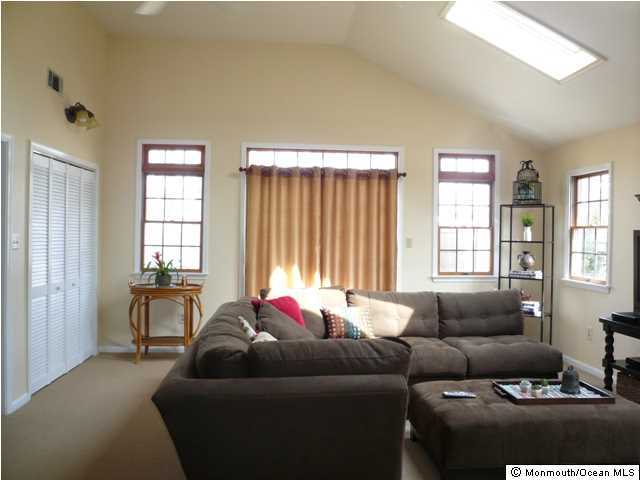 131 Launch Road Manahawkin, NJ 08050 - Photo 12 of 25 a living room with furniture and windows