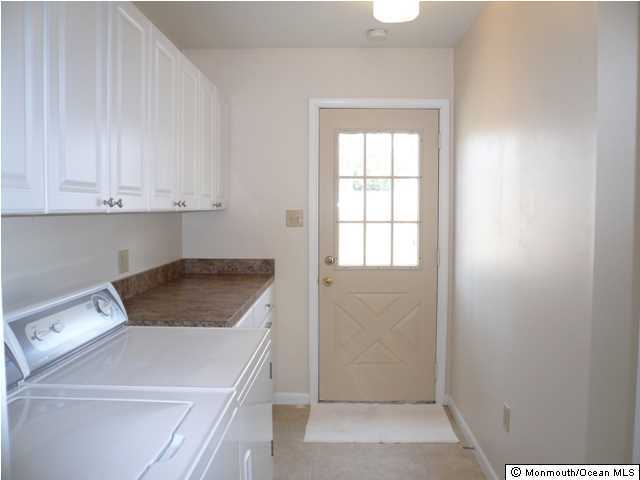 131 Launch Road Manahawkin, NJ 08050 - Photo 20 of 25 a utility room with dryer and washer