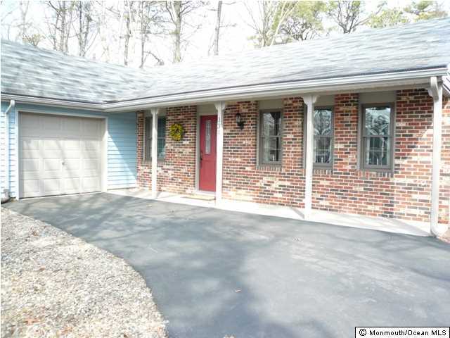 131 Launch Road Manahawkin, NJ 08050 - Photo 2 of 25 a view of a brick house with a outdoor space