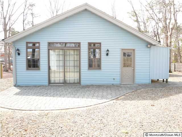 131 Launch Road Manahawkin, NJ 08050 - Photo 21 of 25 a view of a house with a door and a yard