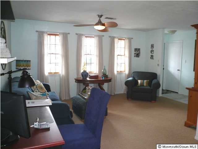 131 Launch Road Manahawkin, NJ 08050 - Photo 6 of 25 a living room with furniture and a flat screen tv