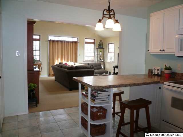 131 Launch Road Manahawkin, NJ 08050 - Photo 10 of 25 a kitchen with a sink cabinets and window
