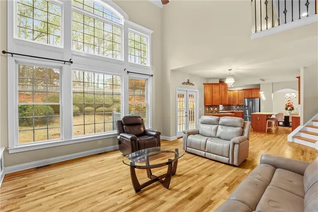 a living room with furniture and a large window