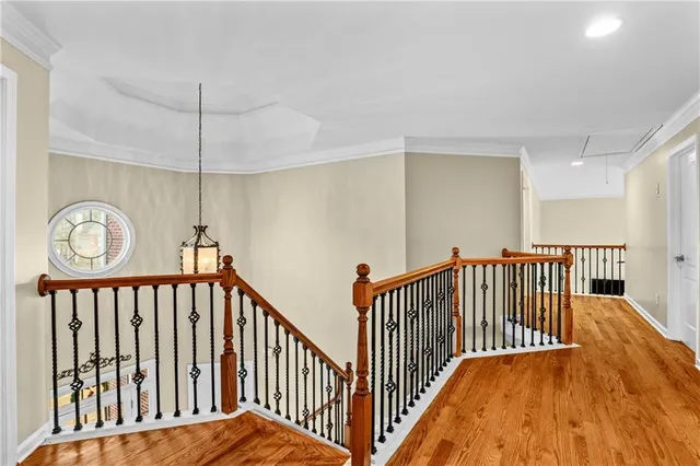 a view of hallway with wooden floor