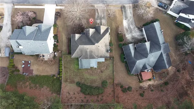 an aerial view of a house with outdoor space