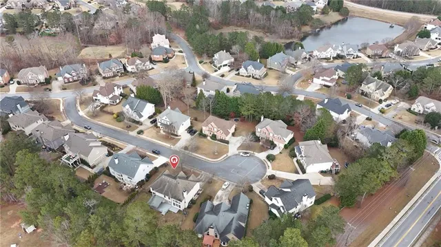 an aerial view of residential houses with outdoor space