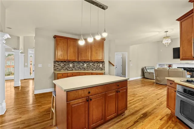 a view of a kitchen counter space and wooden floor