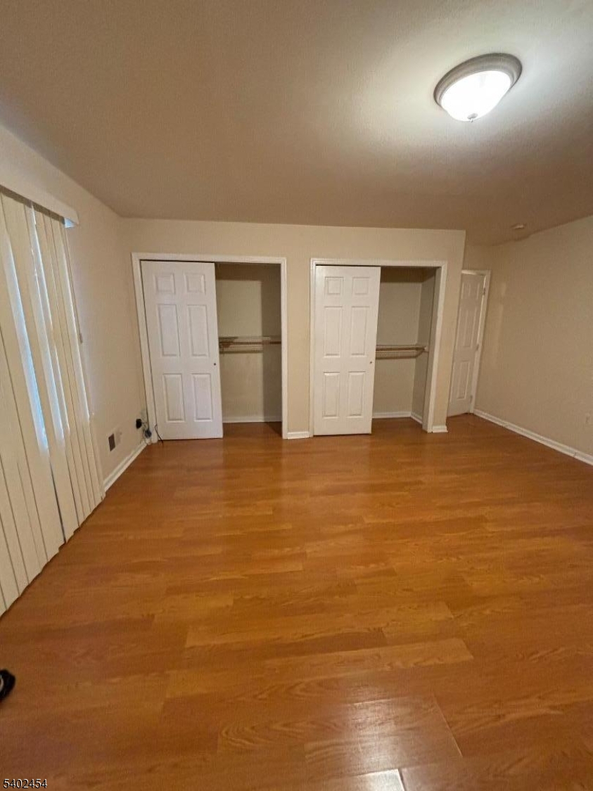 18 Harrison Street Belleville, NJ 07109 - Photo 15 of 18 an empty room with closet and windows