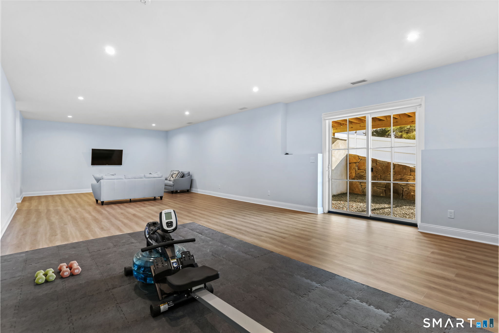 218 Lower Farm Road Fairfield, CT 06824 - Photo 37 of 40 17' x 39' walk-out lower level with sliders to covered patio (Terrace)