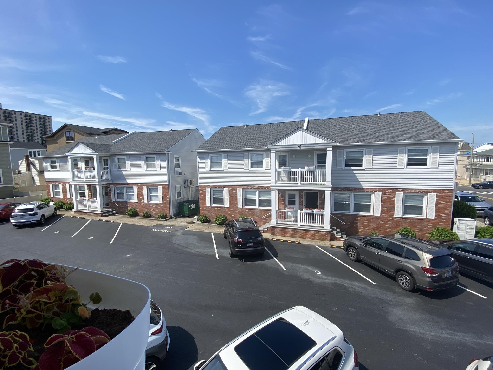 a front view of a house with sitting area