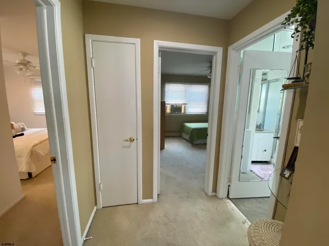 a view of a bathroom from a hallway