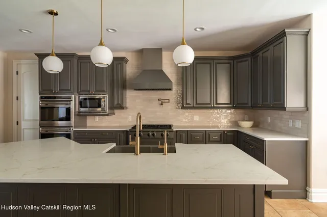 a kitchen with a table and chairs in it