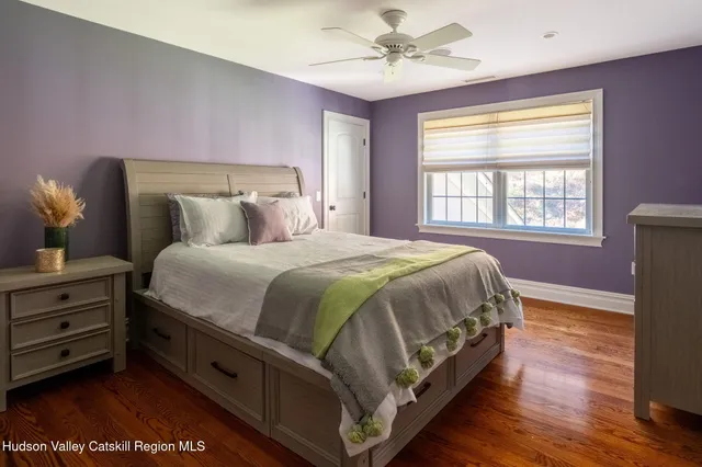 a bathroom with a sink mirror and shower