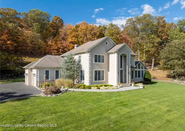 a view of a fountain in the backyard of the house