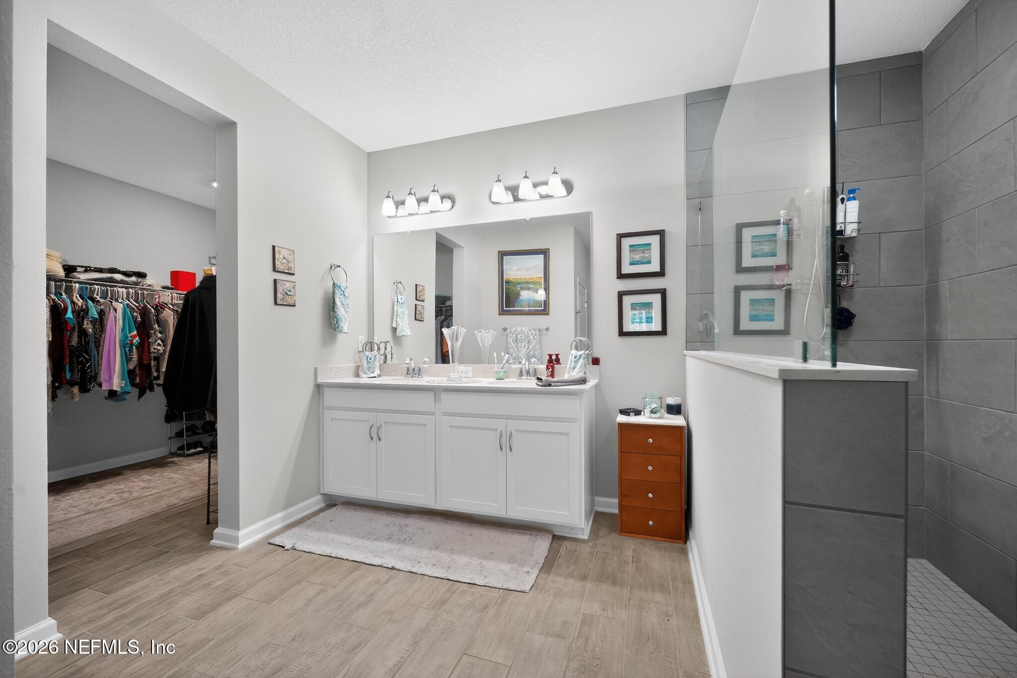75505 Banyan Way Yulee, FL 32097 - Photo 21 of 30 a bathroom with a sink vanity and mirror