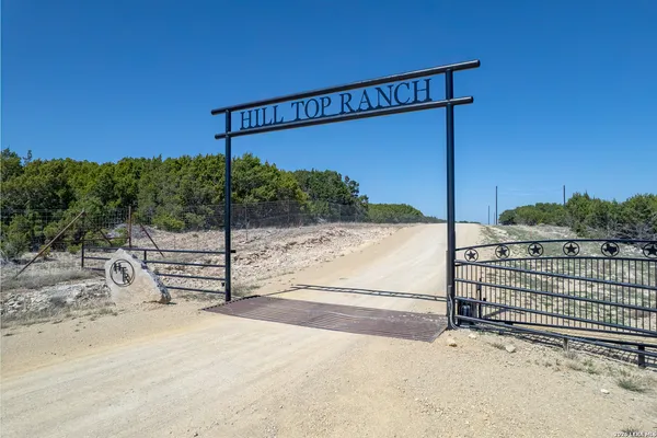 a view of a terrace with wooden fence