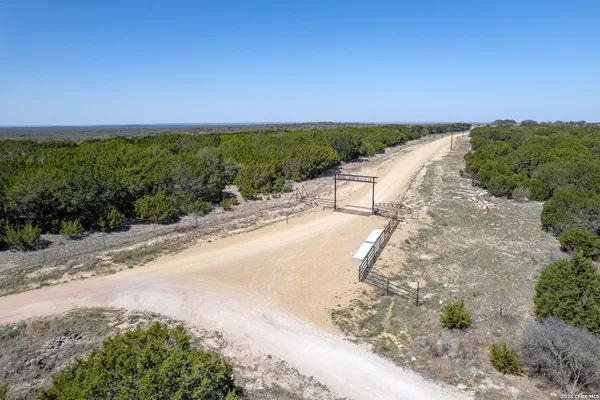 a view of a pathway with a yard