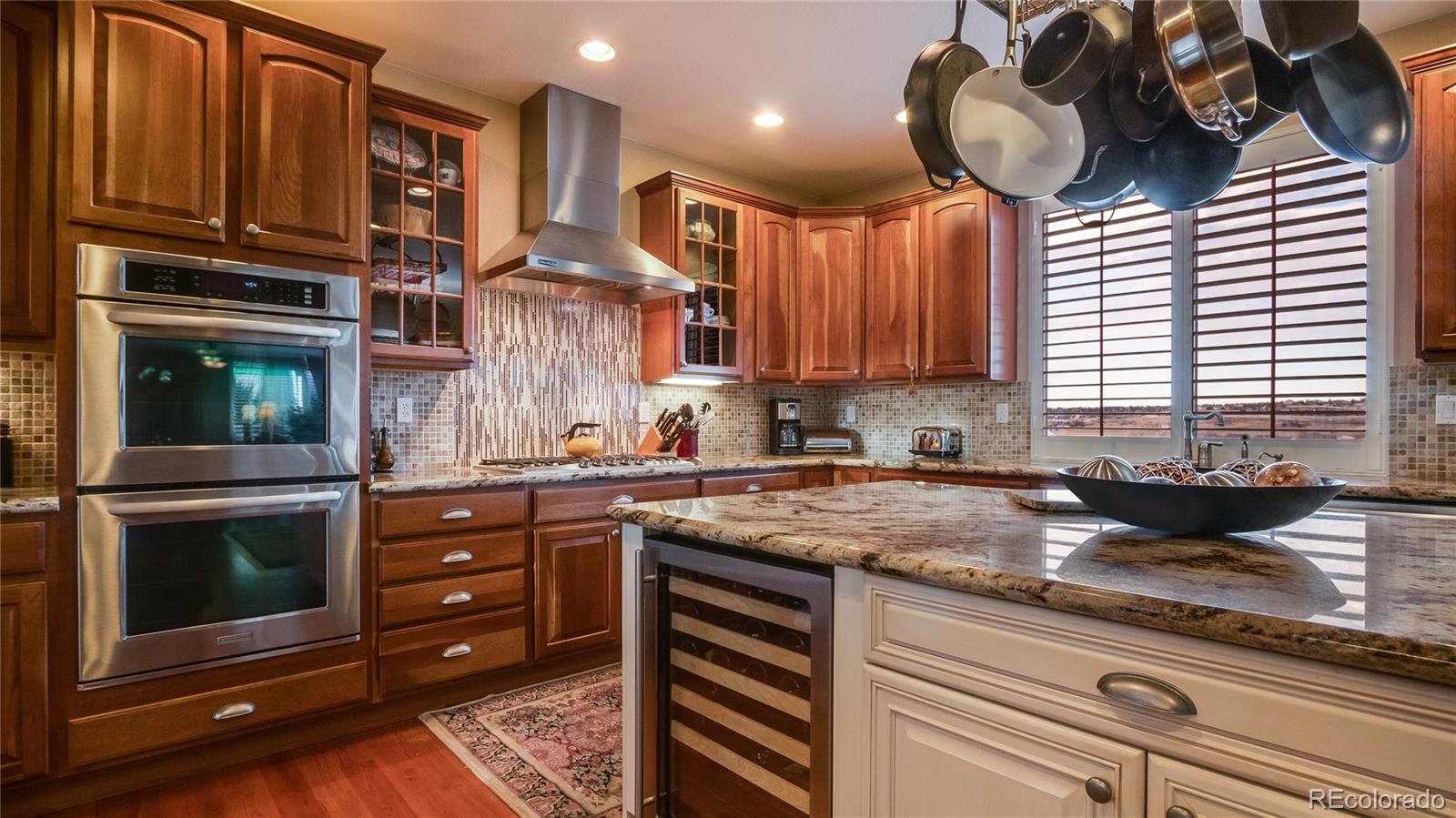 5310 Streambed Trail Parker, CO 80134 - Photo 11 of 35 a kitchen with a sink and cabinets
