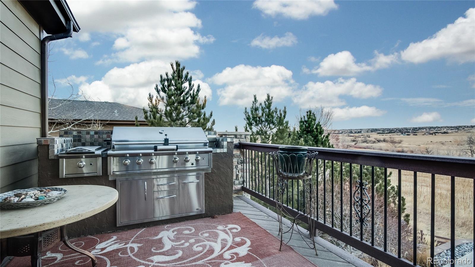 5310 Streambed Trail Parker, CO 80134 - Photo 29 of 35 a balcony with an outdoor seating
