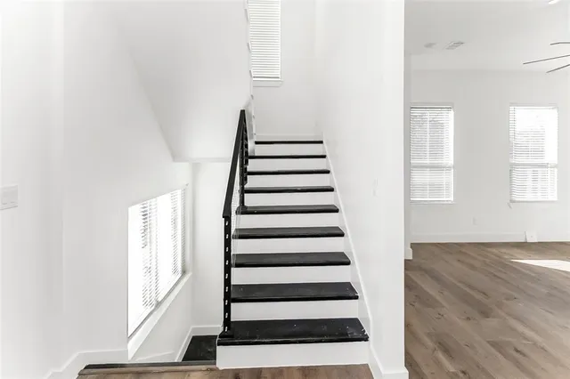 a view of entryway with wooden floor and stairs