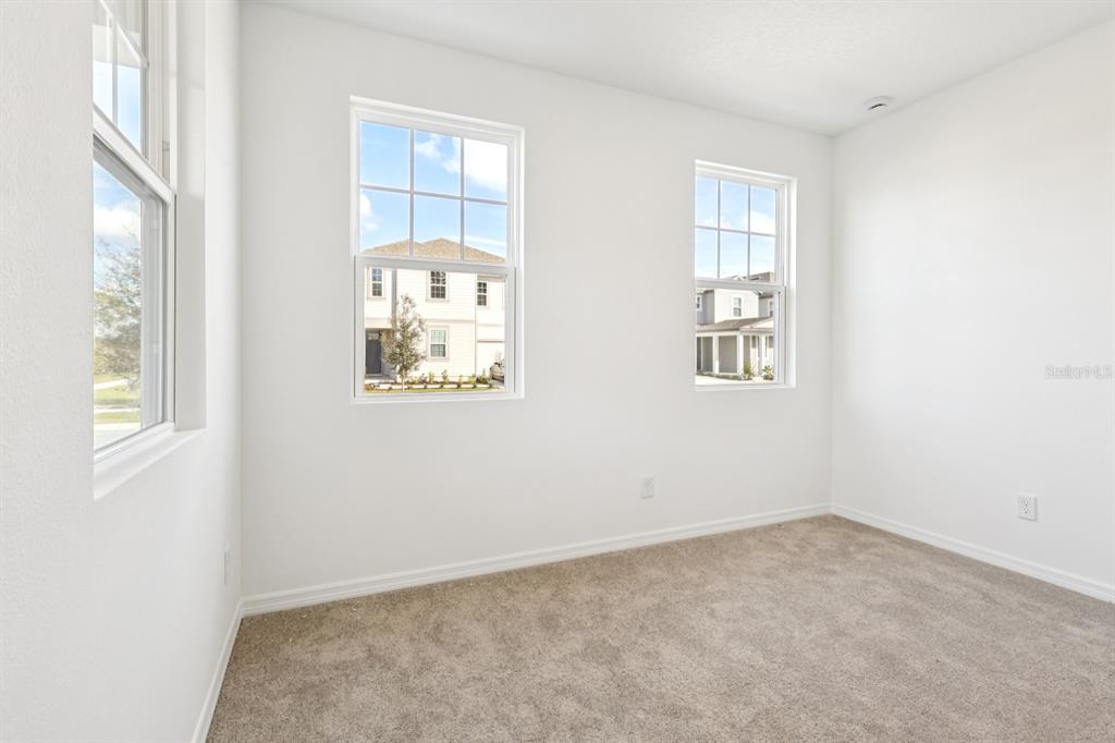 2298 Broadbrook Drive St. Cloud, FL 34771 - Photo 18 of 40 an empty room with windows