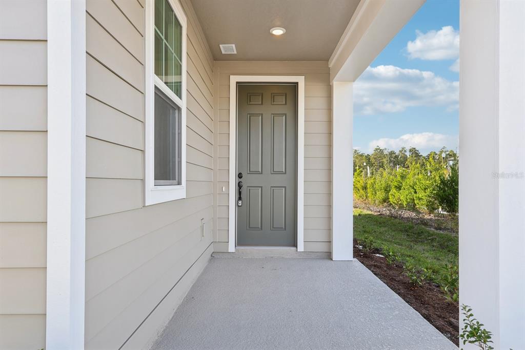 2298 Broadbrook Drive St. Cloud, FL 34771 - Photo 3 of 40 front view of a house with a yard