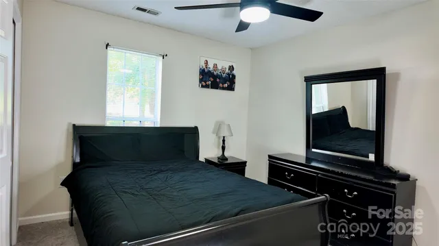 a bathroom with a sink toilet and mirror