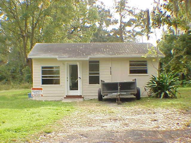 1704 Brooker Road Jacksonville, FL 32207 - Photo 1 of 1 a front view of a house with a yard