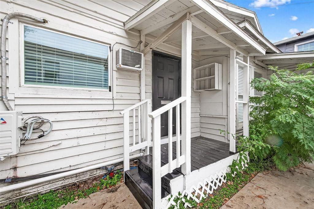 1511 Scharpe Street, Unit 2 Houston, TX 77023 - Photo 4 of 27 a view of a house with a small deck and wooden fence
