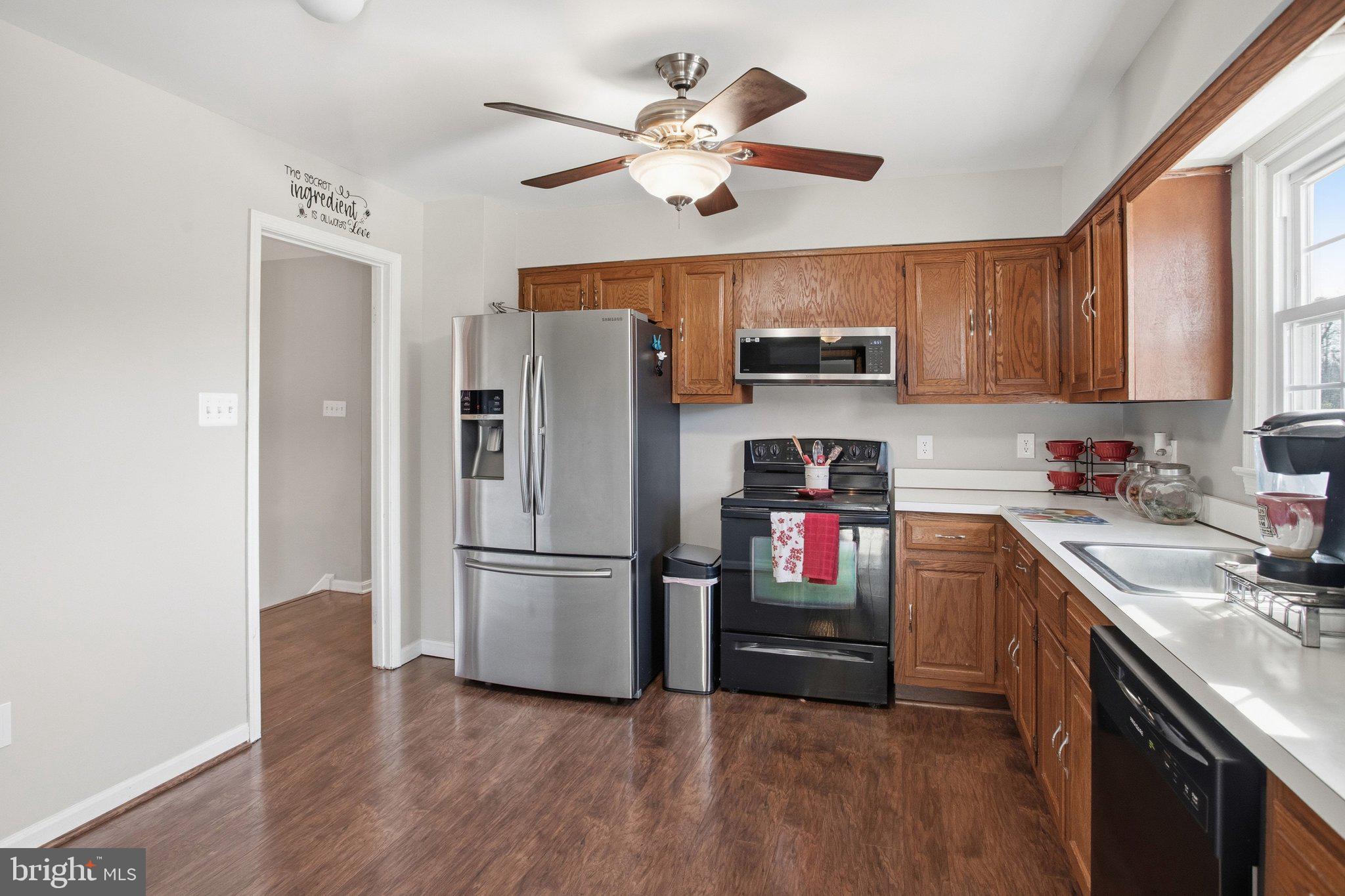 331 Joshua Road Stafford, VA 22556 - Photo 11 of 38 Modern kitchen with warm wood accents.