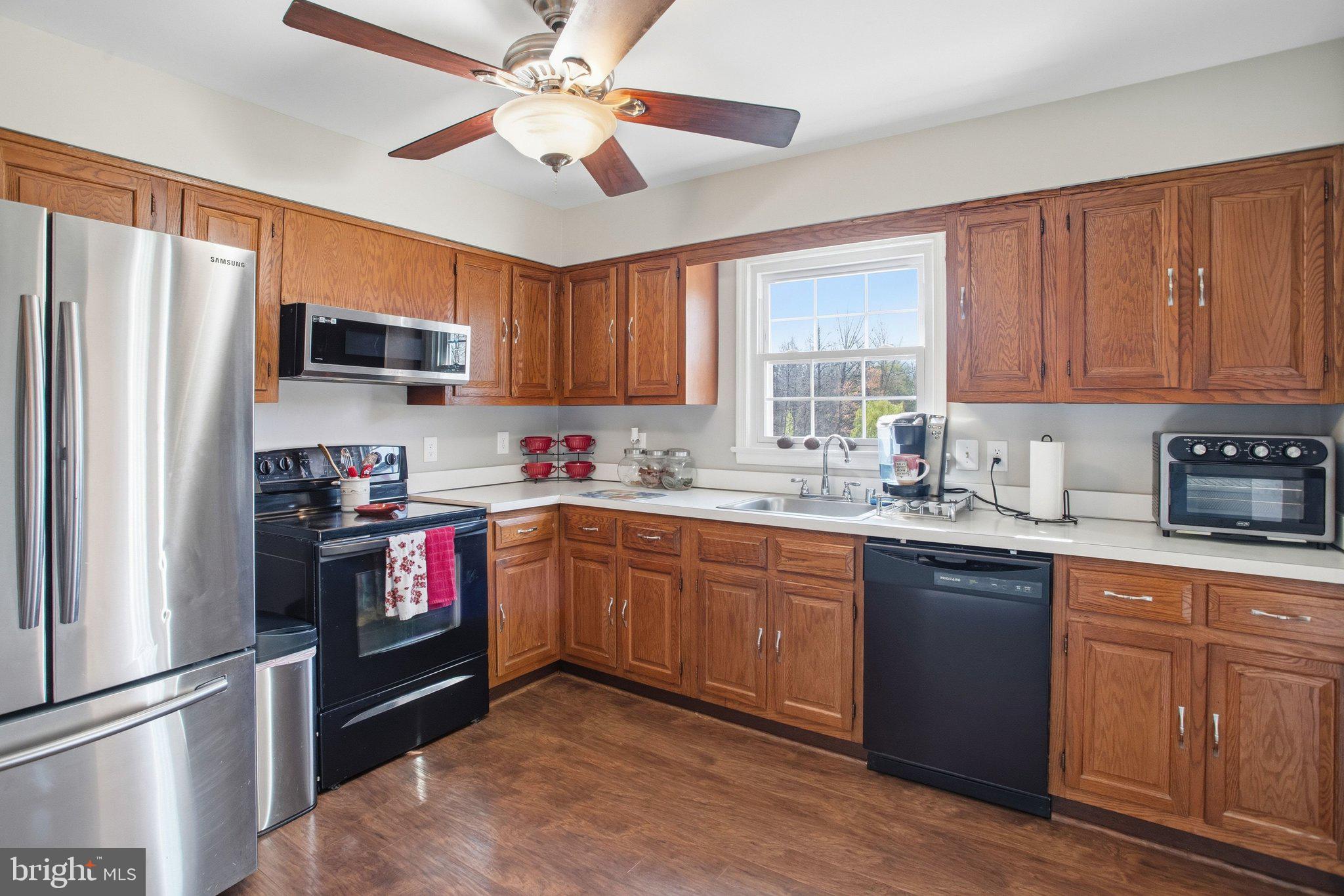 331 Joshua Road Stafford, VA 22556 - Photo 13 of 38 Modern kitchen with warm wood accents.
