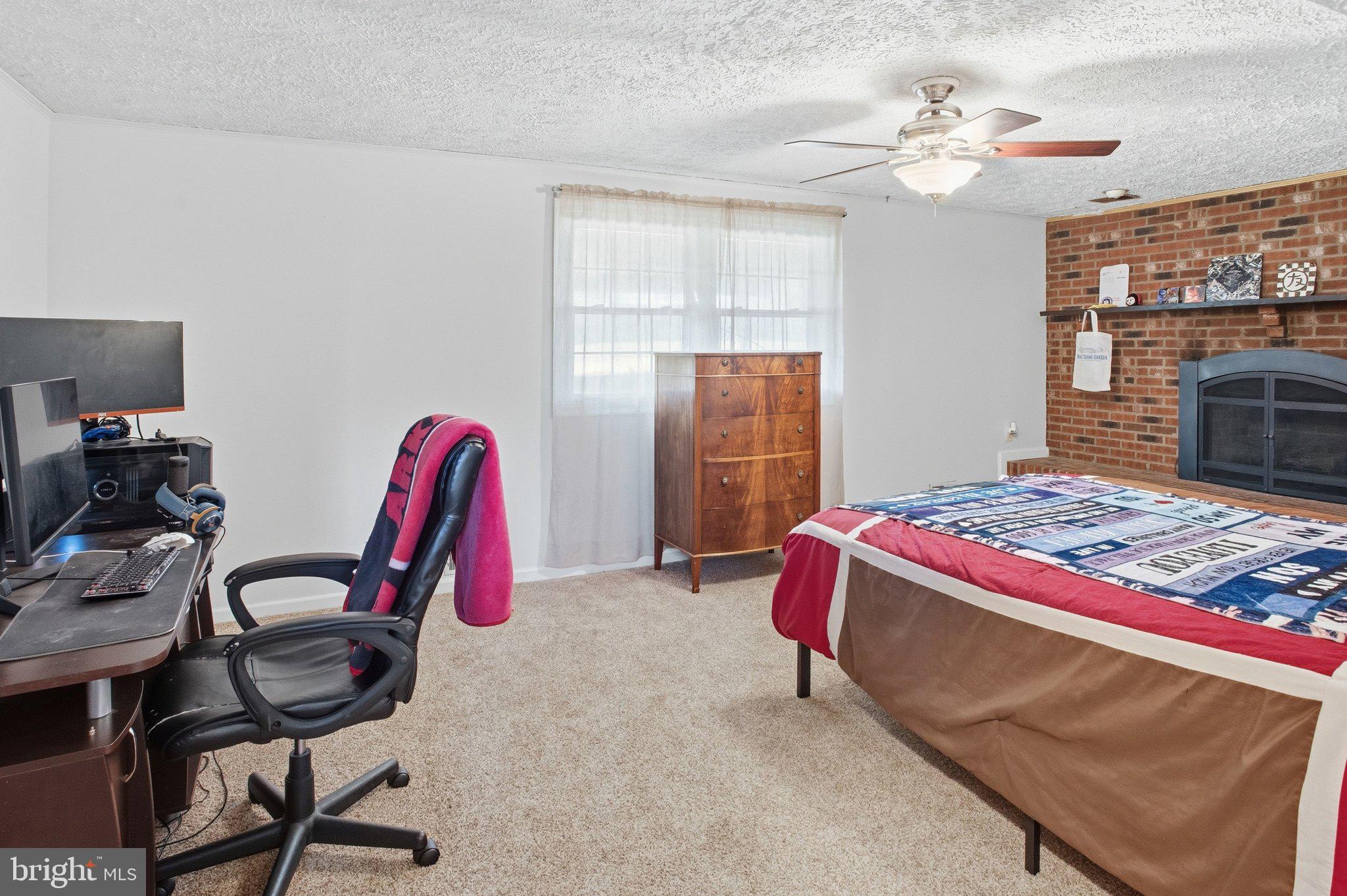 331 Joshua Road Stafford, VA 22556 - Photo 27 of 38 Cozy bedroom with rustic charm.