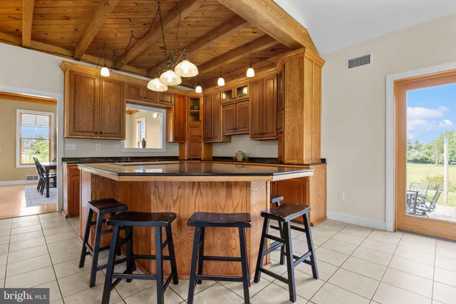 a spacious bedroom with a bed and a window
